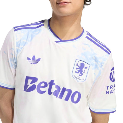 Camiseta Aston Villa tercera equipación 2025-2026 blanca con detalles lilas, patrocinadores y escudo