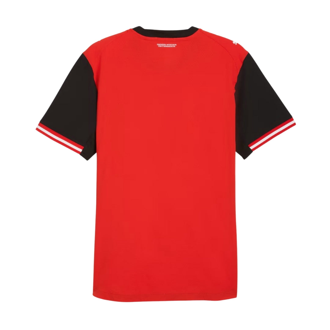 Camiseta de fútbol roja con mangas negras y detalles blancos, Reino del Futbol Austria.