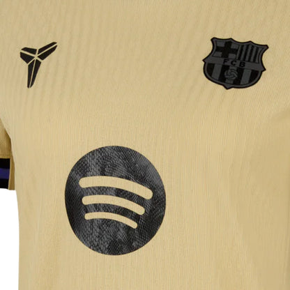 Camiseta Barcelona mujer away dorada con escudo FCB y logo patrocinador Spotify, Reino del Futbol