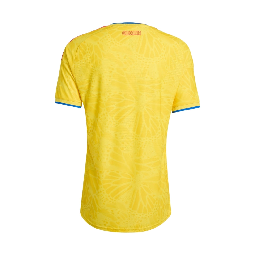 Camiseta Colombia local 2024 amarilla detalles azul, diseño mariposas, vista trasera, Reino del Futbol