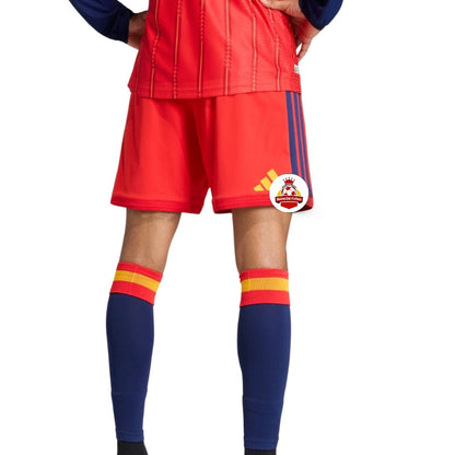 Uniforme de fútbol rojo con medias azul marino y logo Reino del Futbol