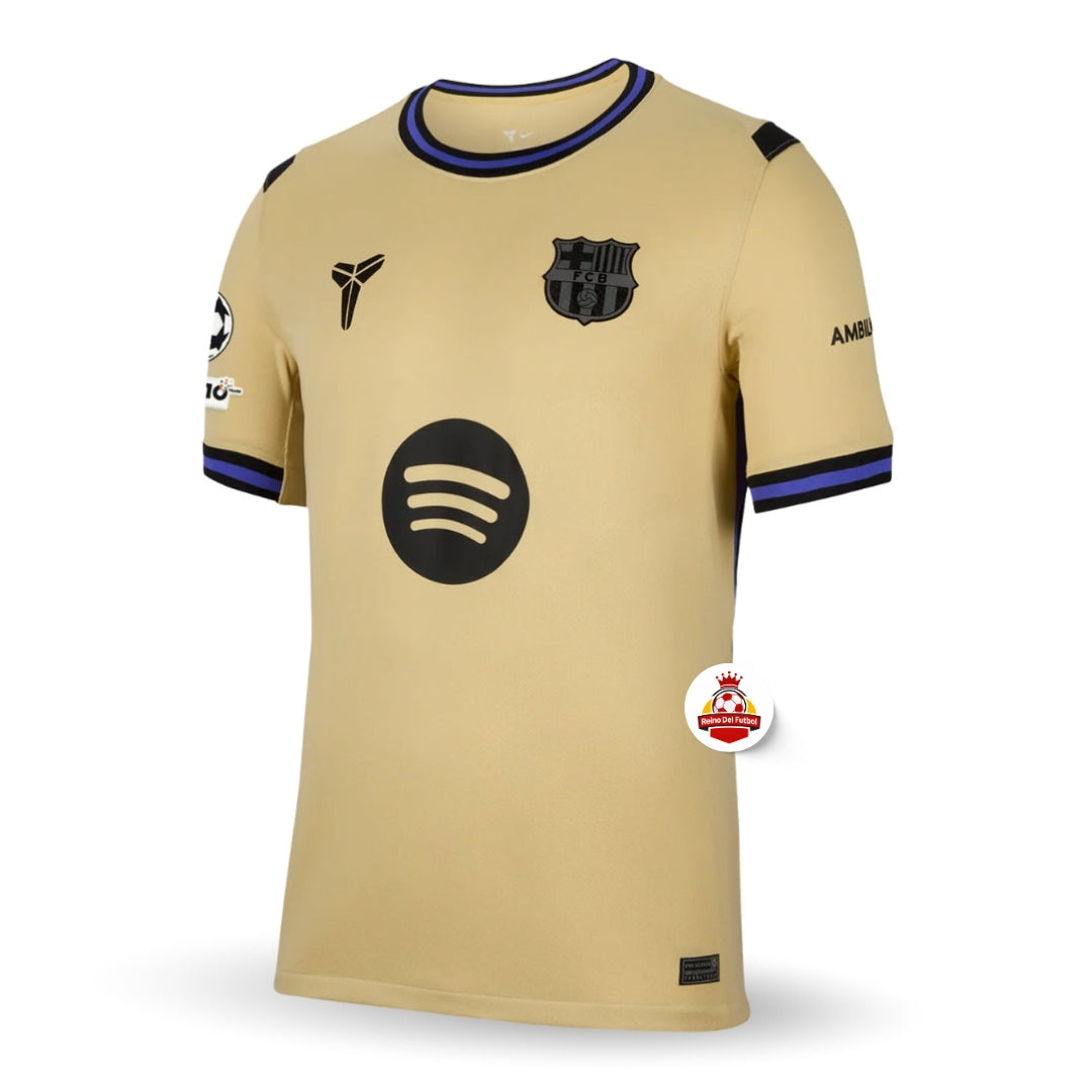 Camiseta dorada del FC Barcelona con logo Spotify y escudo, disponible en Reino del Futbol