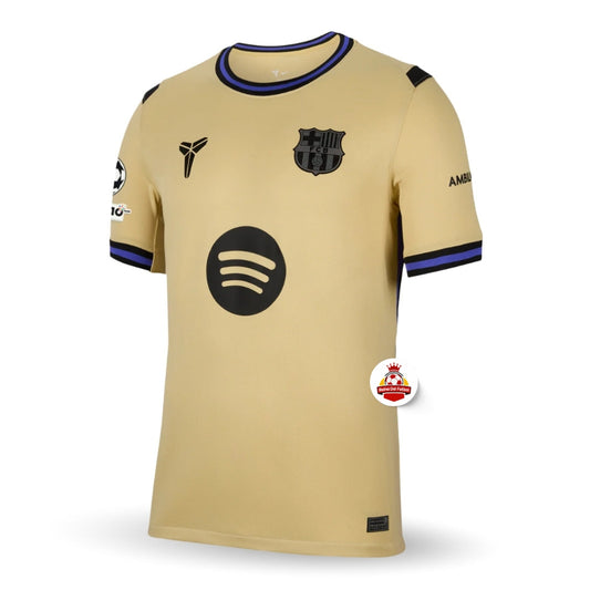 Camiseta dorada del FC Barcelona con logo Spotify y escudo, disponible en Reino del Futbol