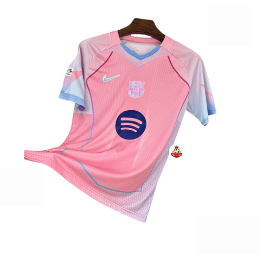 Camiseta de fútbol rosa y azul claro del FC Barcelona con logo Nike y patrocinador Spotify