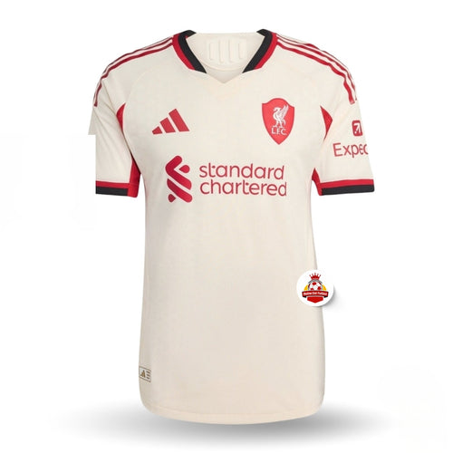 Camiseta de fútbol europea blanca del Liverpool FC con detalles rojos, edición disponible en Reino del Futbol.
