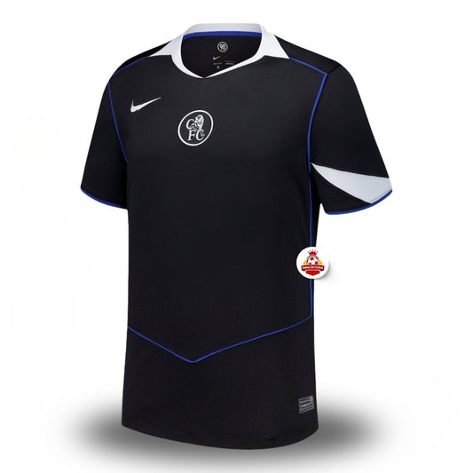 Camiseta de fútbol negra con detalles azules y blancos, logo Nike y escudo en el pecho, Reino del Futbol