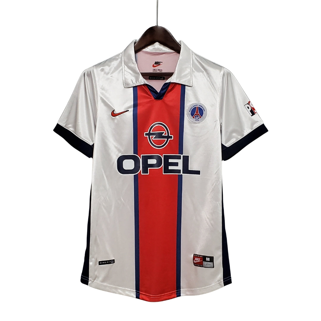 Camiseta de fútbol PSG blanca retro, logo Opel, detalles rojos y azules, venta online en Reino del Futbol