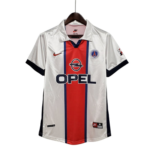 Camiseta de fútbol PSG blanca retro, logo Opel, detalles rojos y azules, venta online en Reino del Futbol