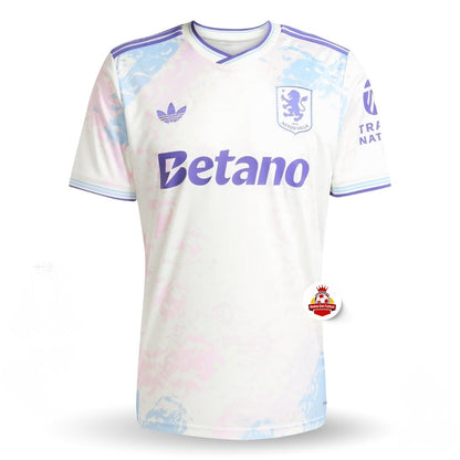 Camiseta oficial Aston Villa blanca con detalles lilas y azul, logo Betano y Reino del Futbol