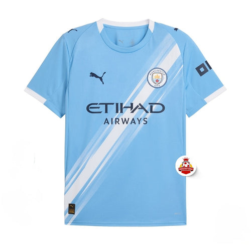 Camiseta Manchester City azul claro con franjas blancas, logo Puma y escudo, Reino del Futbol