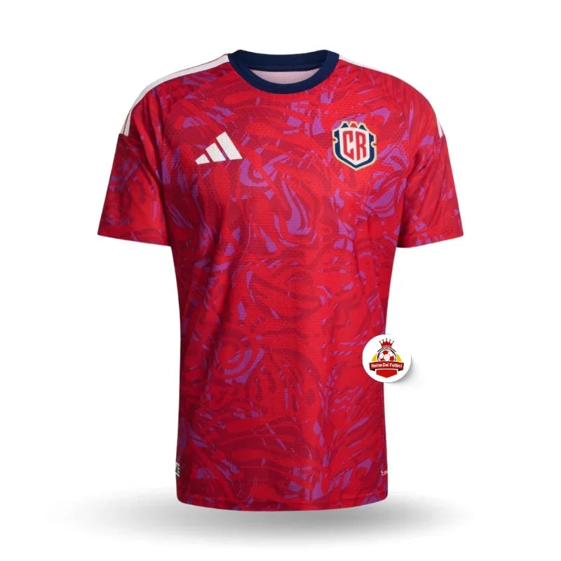 Camiseta de fútbol roja con detalles morados, escudo CR y logo Adidas, Reino del Futbol