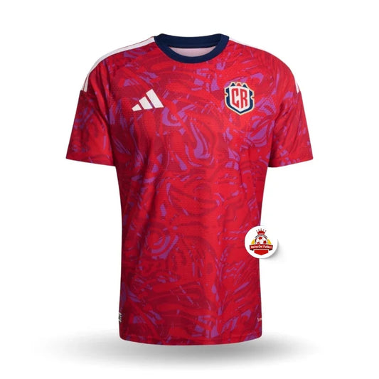 Camiseta de fútbol roja con detalles morados, escudo CR y logo Adidas, Reino del Futbol