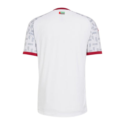 Camiseta blanca fútbol Emiratos Árabes diseño moderno, detalles grises y bandera en la espalda