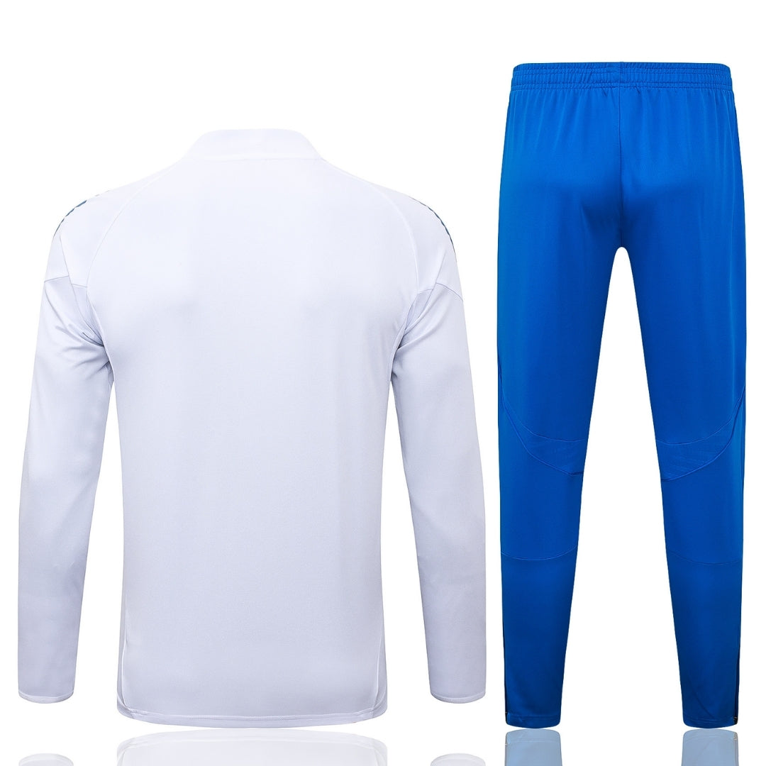 Chándal Real Madrid adulto, chaqueta blanca y pantalón azul, Reino del Futbol