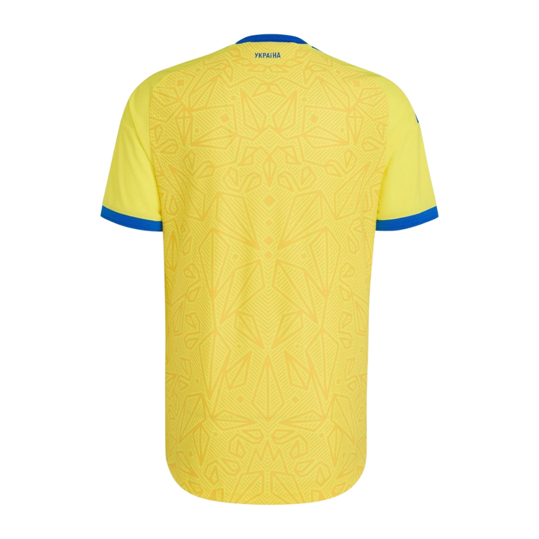 Camiseta de fútbol Ucrania 2026 color amarillo con detalles geométricos y bordes azules, Reino del Futbol