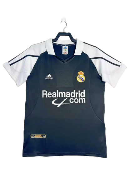 Camiseta retro Real Madrid 2001-2002 visitante negra y blanca, logo Adidas y escudo club