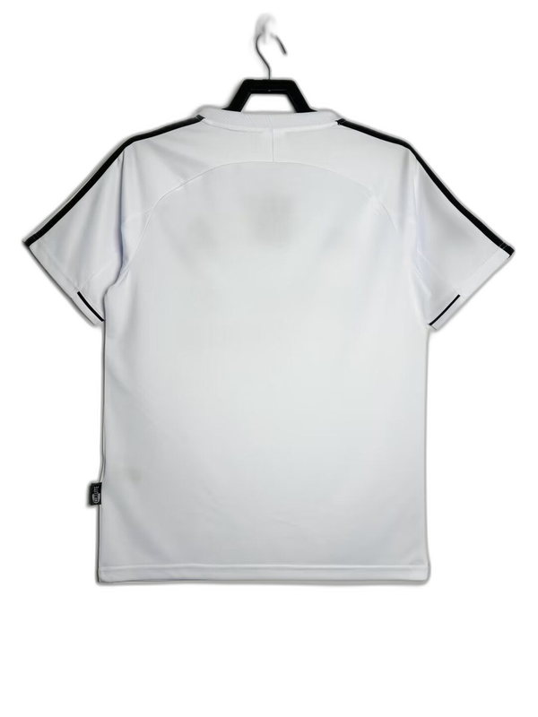 Camiseta retro Real Madrid 2003-2004 blanca con detalles negros en hombros, Reino del Futbol