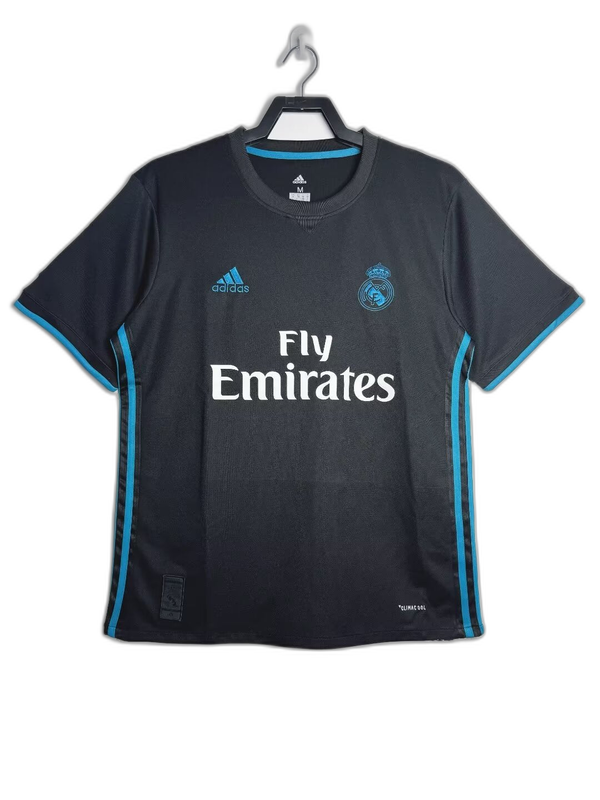 Camiseta Real Madrid 17/18 visitante negra con detalles azul celeste, logo Adidas y Fly Emirates