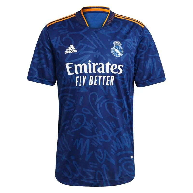 Camiseta Real Madrid 21/22 azul versión jugador, detalles dorados y logotipo Adidas.