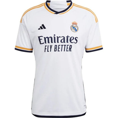 Camiseta Real Madrid 2023-24 local para aficionado, blanca, detalles dorados y logos oficiales