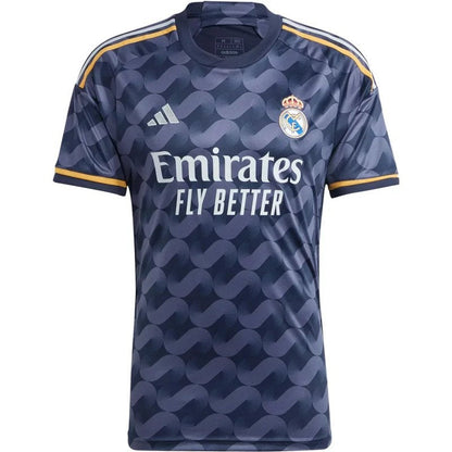 Camiseta Real Madrid 2023/24 azul marino, edición afición, con logotipos y detalles dorados.