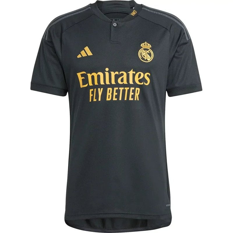 Camiseta Real Madrid 2023/24 tercera equipación negra con detalles dorados, versión aficionado.