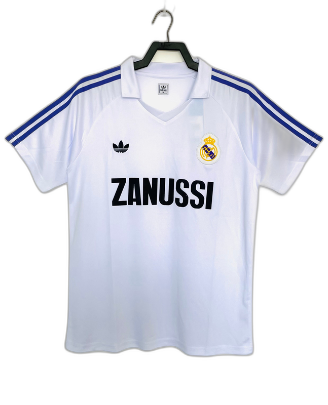 Camiseta retro Real Madrid 84/85 blanca con logo Zanussi, escudo y detalles azules, Reino del Futbol