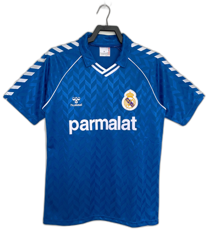 Camiseta retro azul Real Madrid 86-87 visitante, logo Hummel y patrocinador Parmalat.