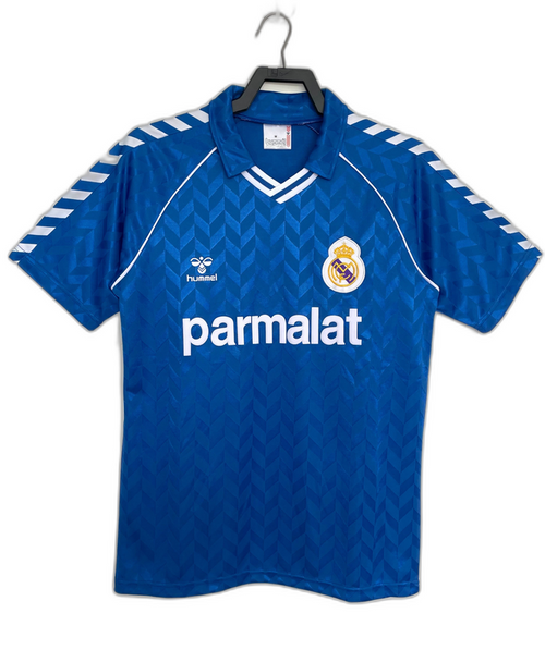 Camiseta retro azul Real Madrid 86-87 visitante, logo Hummel y patrocinador Parmalat.