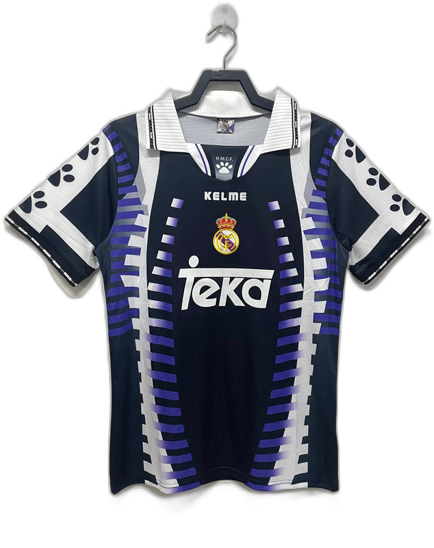 Camiseta retro Real Madrid 97/98 visitante azul oscuro con detalles blancos y morados, logo Kelme y Teka, disponible en Reino del Futbol.