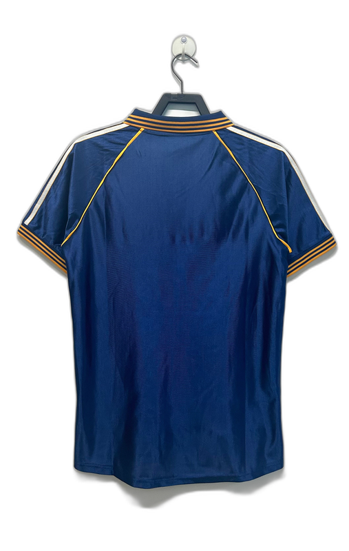 Camiseta retro Real Madrid 98-00 azul marino, rayas blancas y detalles dorados, vista trasera