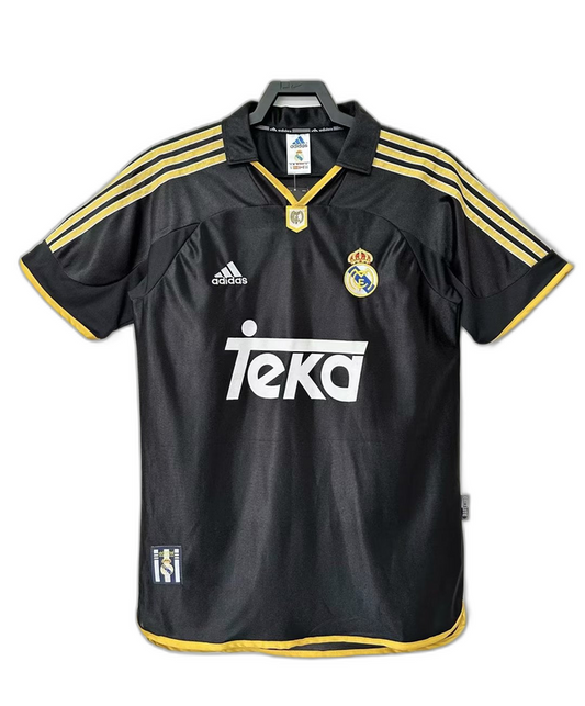 Camiseta Real Madrid 1999-2001 negra retro, con detalles amarillos y logo Teka